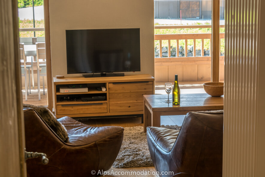Appartement Les Niveoles A12 Morillon - Le séjour est équipé d'une grande TV LCD, Playstation 3 et WiFi
